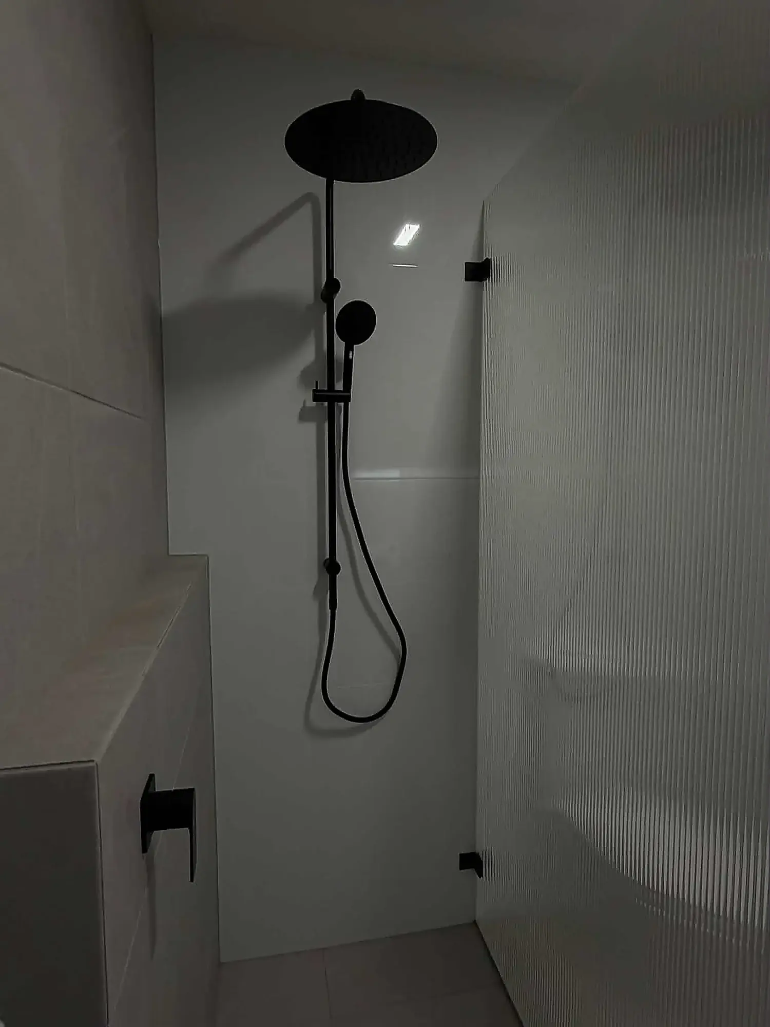 Walk-in shower, floor-to-ceiling tile